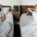 Sleep Divorce: साथ रहते हुए अलग सोना? जानिए क्यों बढ़ रही है स्लीप डिवोर्स की ट्रेंड!